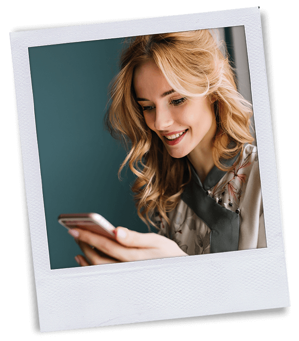 Polaroid of blonde woman on cell phone